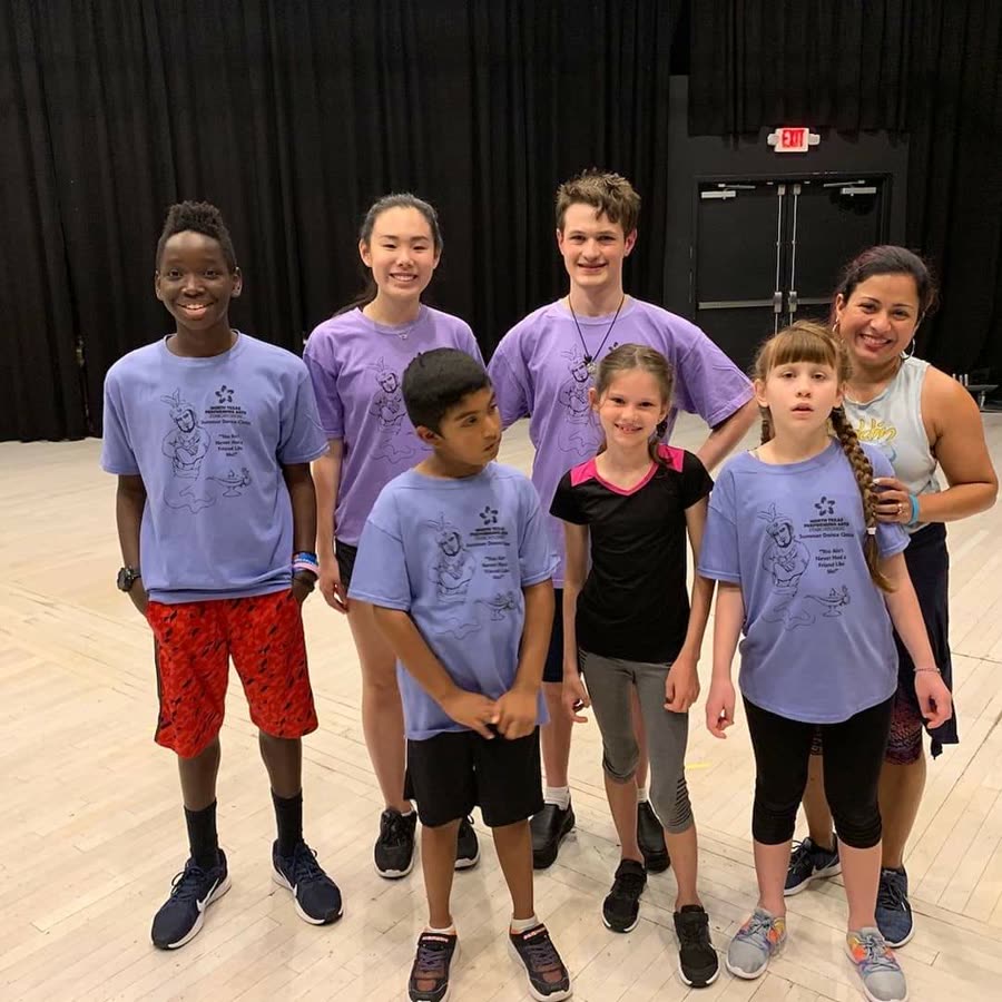 Diverse group of young Jasmine's Beat performers posing together in costume