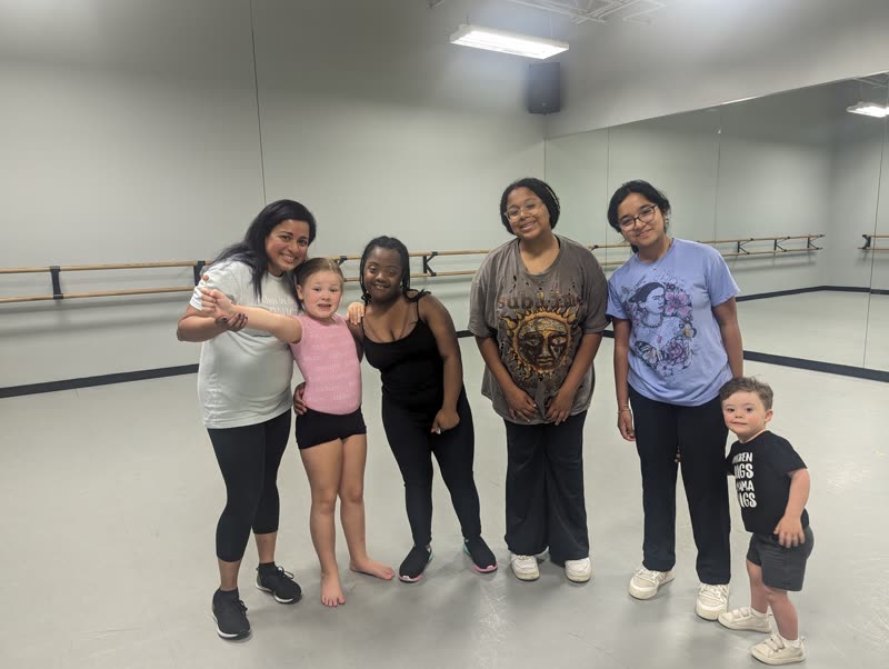 Instructor with a large, diverse group of Jasmine's Beat dancers in a studio